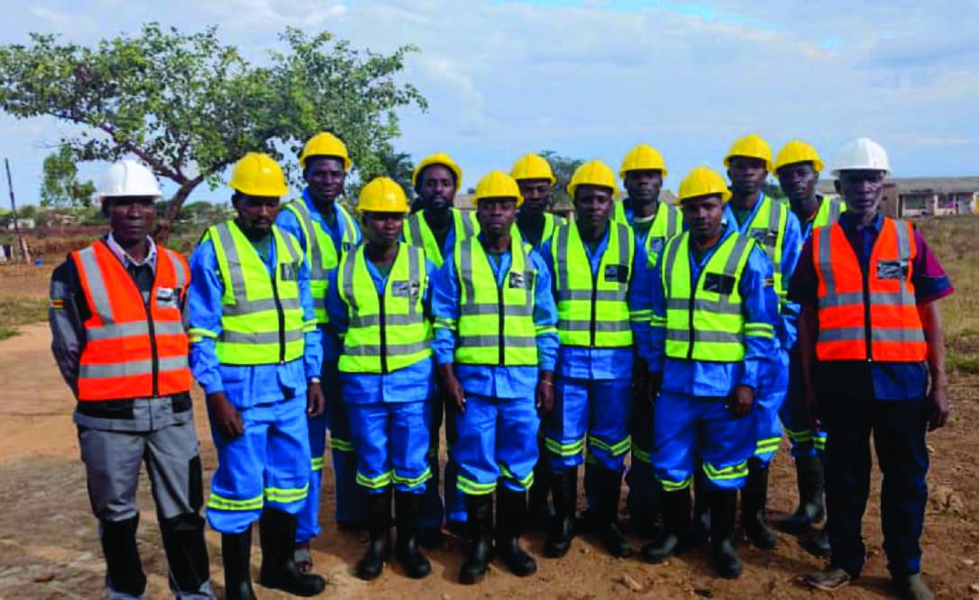 Fourteen Guide Construction site staff in overalls and hi-vis on site.