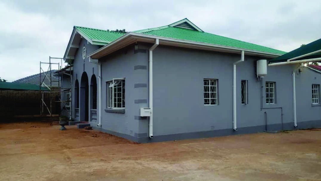 Completed single-storey office complex with a green roof, Bulawayo.